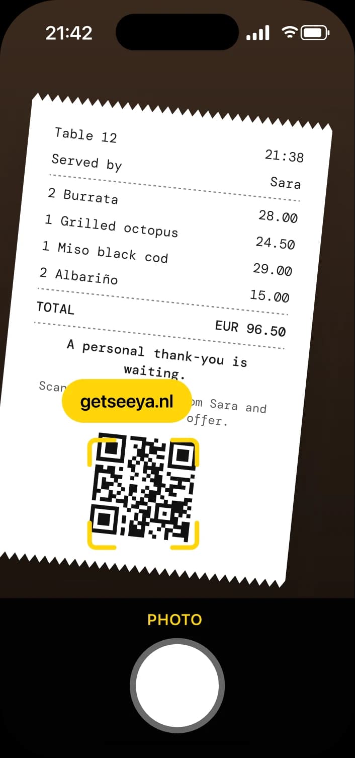 Phone camera scanning the QR code on a receipt